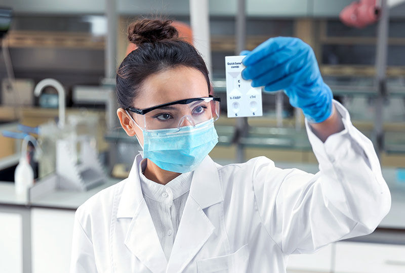 Scientist examining test device